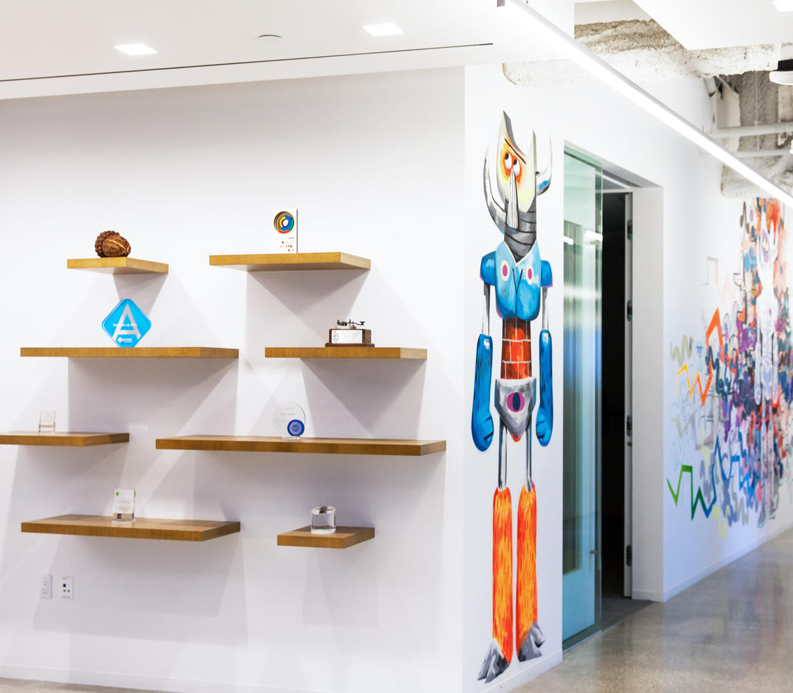 Shelves and mural in the Acorns office